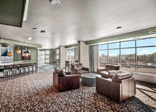 Clubhouse kitchen seating area at District at Scottsdale Apartments in Scottsdale AZ