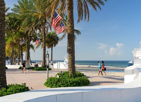 A white building with a dome on top is on the right side of the image.