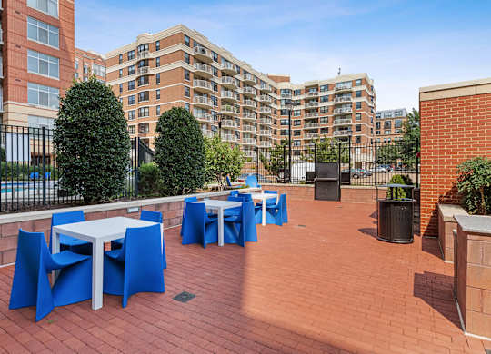 Courtyard tables and chairs at Bradley Braddock Road Station Apartments in Alexandria VA