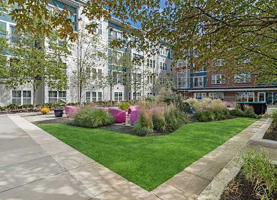 Lush courtyard at Axis Admirals Hill Apartments in Chelsea MA