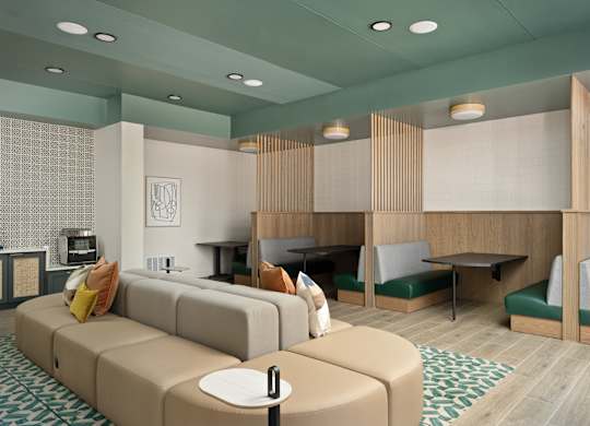 A modern living room with a sofa, chairs, and a coffee table.
