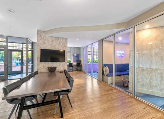 Resident clubhouse with conference table at Bradley Braddock Road Station Apartments in Alexandria VA