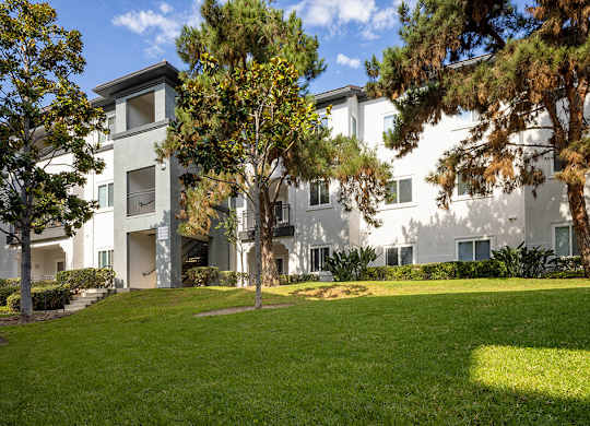 Exterior building and landscaping at Sierra at Otay Ranch Apartments in Chula Vista CA