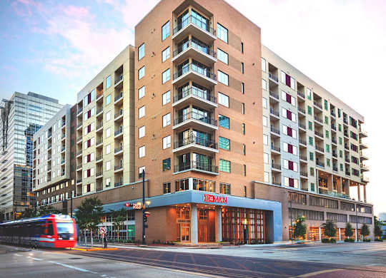 Exterior Building at Dusk at 1810 Main Apartments in Houston TX