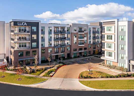 Wide shot of leasing center entry at Luca Apartments in Austin TX