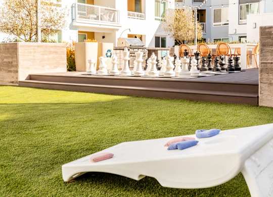 Courtyard cornhole at Bevel Apartments in San Diego CA