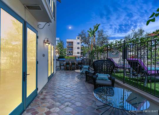 Exterior Courtyard Royal Plaza at Dusk at Cardio Equipment at Candara at Hancock Park Apartments in Los Angeles CA