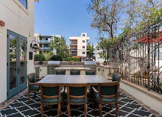 Exterior Courtyard Royal Plaza Grills at Cardio Equipment at Candara at Hancock Park Apartments in Los Angeles CA