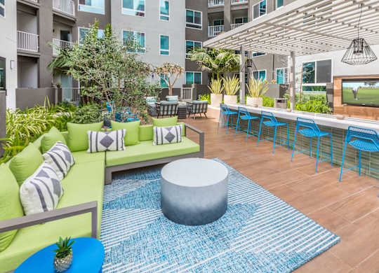 Outdoor courtyard with lounge seating at Avel Apartment Homes in Orange CA