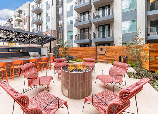 Grill seating area outside at Luca Apartments in Austin TX