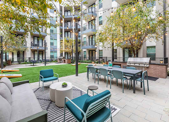 Outdoor grill seating area at Luca Apartments in Austin TX