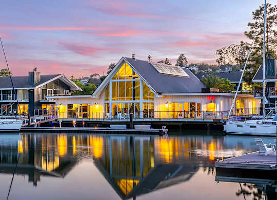 Exterior leasing center at dusk at The Cove at Tiburon Apartments in Tiburon CA
