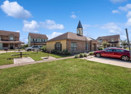 Exterior and lawn of leasing center at Sterling Green and Sheldon Ranch in Channelview TX