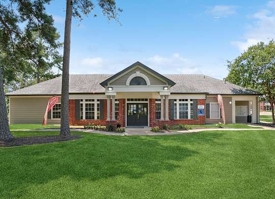Exterior leasing office at Park Village Apartments in Conroe TX