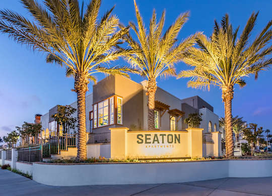 Exterior Monument Sign at Dusk at The Seaton Apartments in San Diego CA