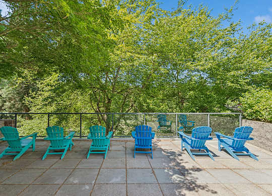 Exterior seating and landscaping at Riverpark Apartments in Redmond WA
