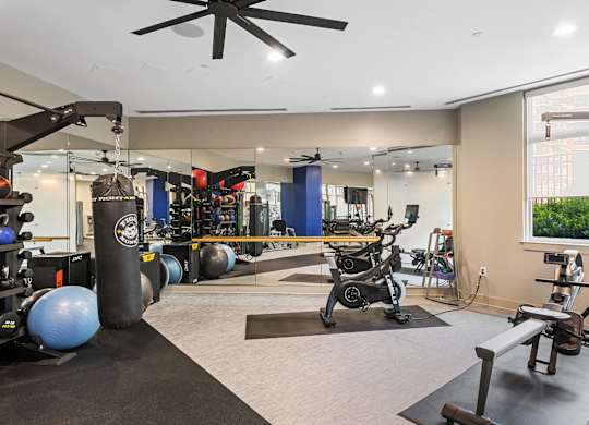 Fitness center weights area at Bradley Braddock Road Station Apartments in Alexandria VA