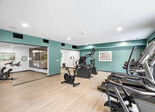 Fitness center cardio machines at East Bend Apartments in Houston TX