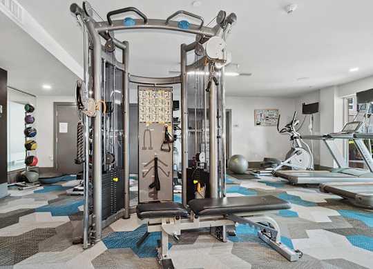 Fitness center weights at Axis Admiral Hill Apartments in Chelsea MA