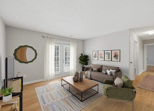 Living room with large window at Greens of Pine Glen in Durham NC