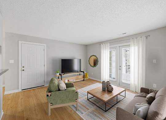 Living room with natural light at Greens of Pine Glen in Durham NC