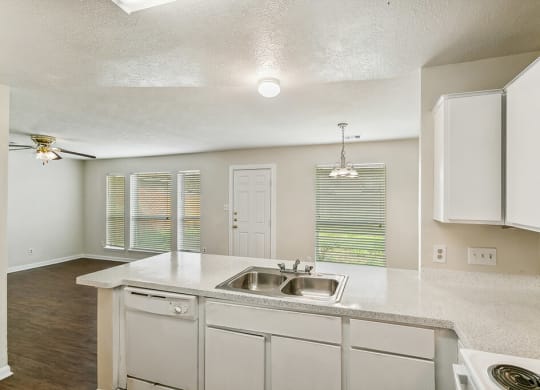 Kitchen with white cabinets at Sterling Green and Sheldon Ranch in Channelview TX