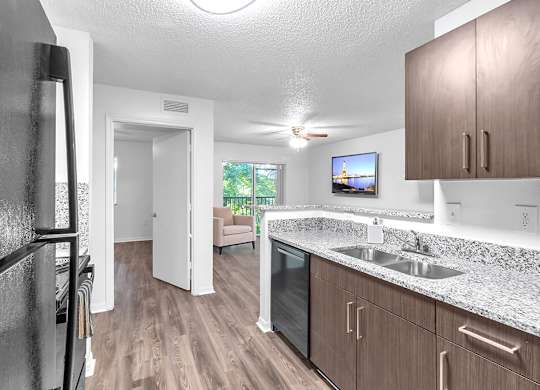 Kitchen with fridge at Cedar Grove Apartments in Miami FL