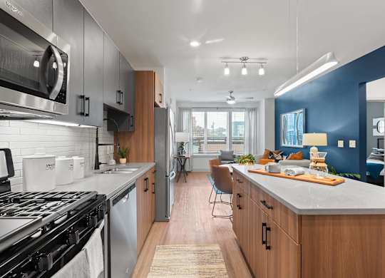 Kitchen and living room at VERO Apartments in Chelsea MA
