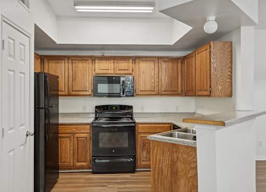 Kitchen with cabinets at Cypress View Villa Apartments in Weatherford TX