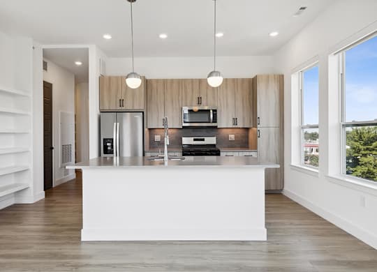 Kitchen with large windows at Jayden Apartments in Peabody MA