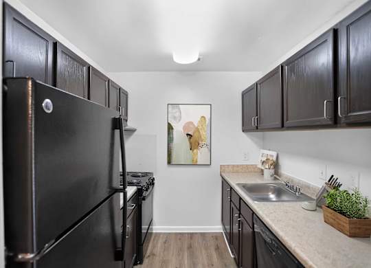 Kitchen with dark cabinets at Weston Circle Apartments in Fredericksburg VA