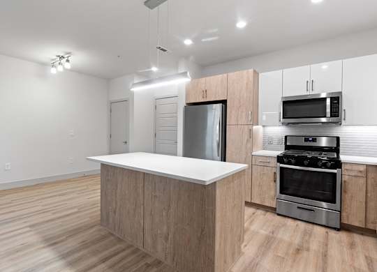 Vacant kitchen with track lighting at VERO in Chelsea MA