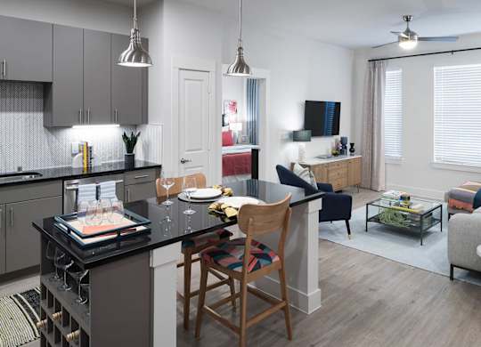 Kitchen with view of living area at Jada Legacy Central Apartments in Plano TX