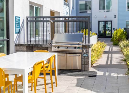 Poolside grilling area at Bevel Apartments in San Diego CA
