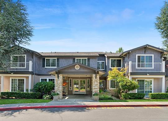 Leasing center exterior at Woodlands at Forbes Lake Apartments in Kirkland WA