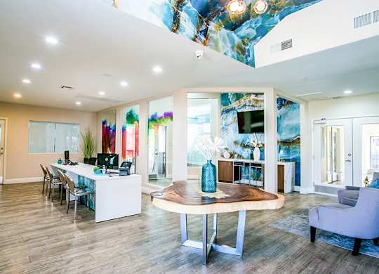 a gallery with many glass displays on the floor