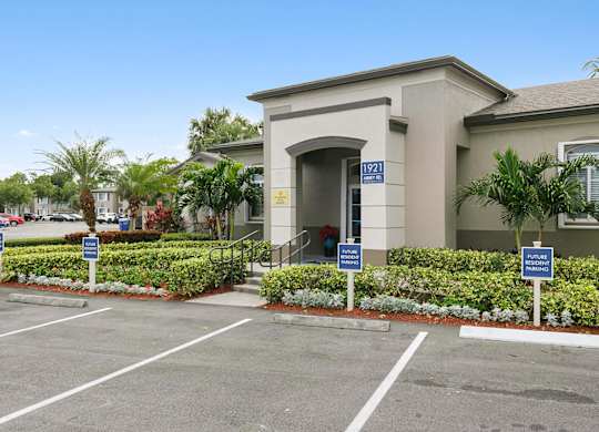 Exterior of leasing office at Brenton at Abbey Park Apartments in West Palm Beach FL