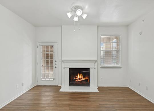 Living room with fire place at Cypress View Villa Apartments in Weatherford TX