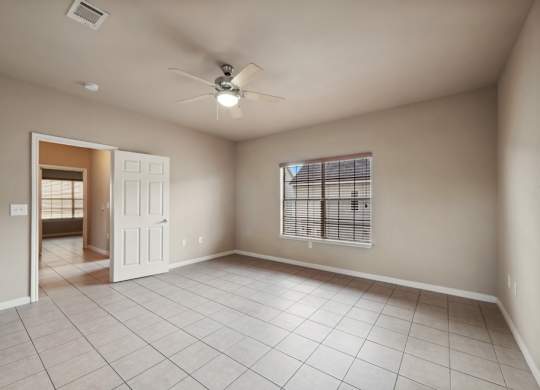 Living room with ceiling fan at Parkway Ranch Rental Homes in Houston TX