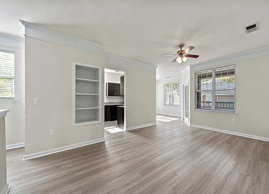 Living room with windows at Grand Oaks Apartments in Chester VA