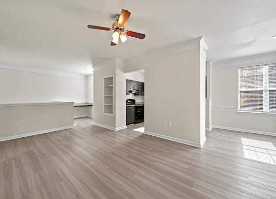 Living room with ceiling fan at Grand Oaks Apartments in Chester VA