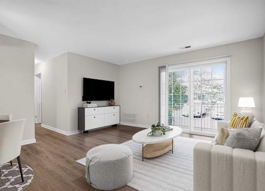 Living room with ceiling fan at Weston Circle Apartments in Fredericksburg VA