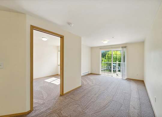 Living room at Woodlands at Forbes Lake Apartments in Kirkland WA