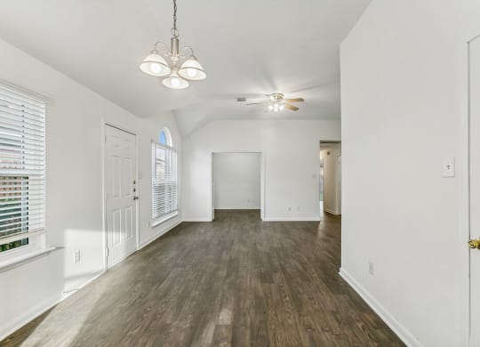Living room with wood flooring at Sterling Green and Sheldon Ranch in Channelview TX