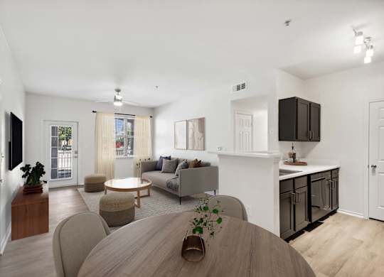 A modern living room with a wooden table and grey couches.