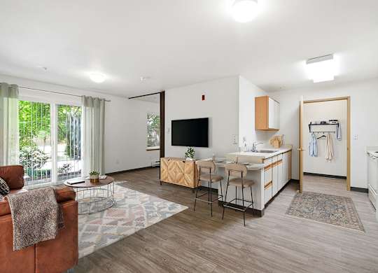 A living room with a brown chair and a white couch.