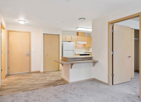 Living area and kitchen at Cedar Park Apartments in Seattle WA