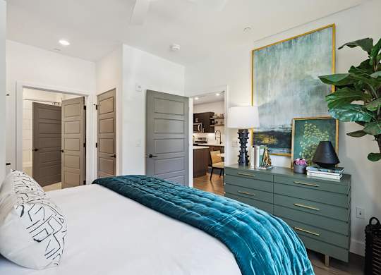 Model bedroom with furniture at Jayden Apartments in Peabody MA