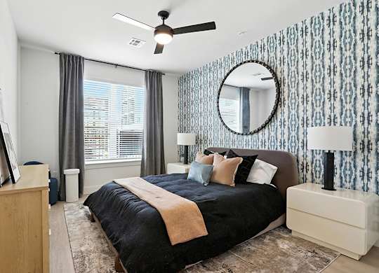 Bedroom with ceiling fan at Station 316 Woburn MA