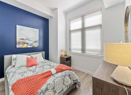 Bedroom with hardwood flooring at Bradley Braddock Road Station Apartments in Alexandria VA